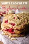 A close up photo of a stack of three white chocolate raspberry cookies.