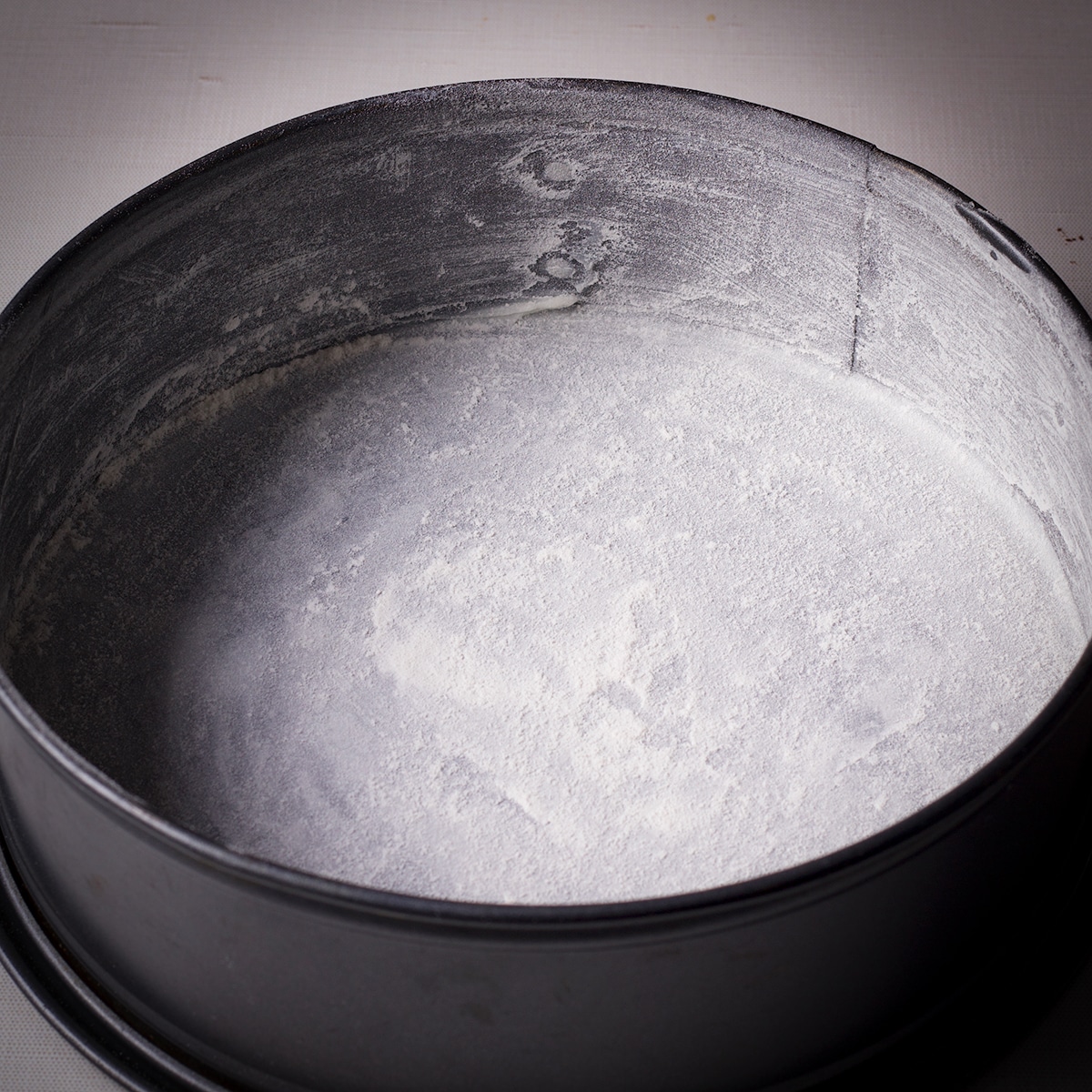 A springform pan that's been fitted with parchment paper and greased and floured so the cake won't stick while it bakes.