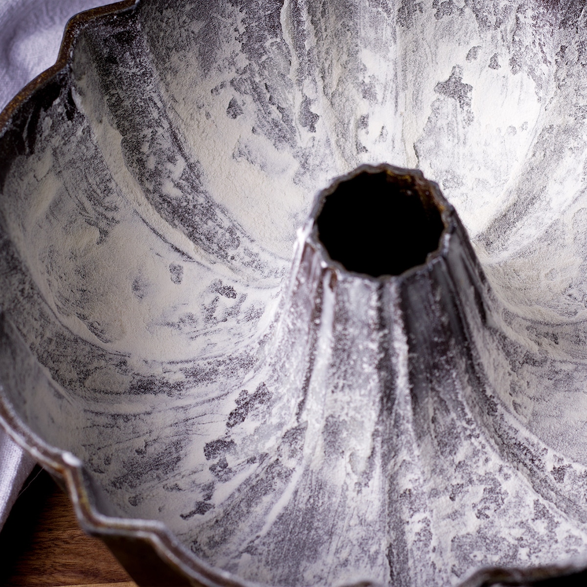Looking down into a bundt pan that's been coated with butter and flour.