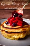 Spooning easy berry sauce over a stack of buttermilk pancakes.