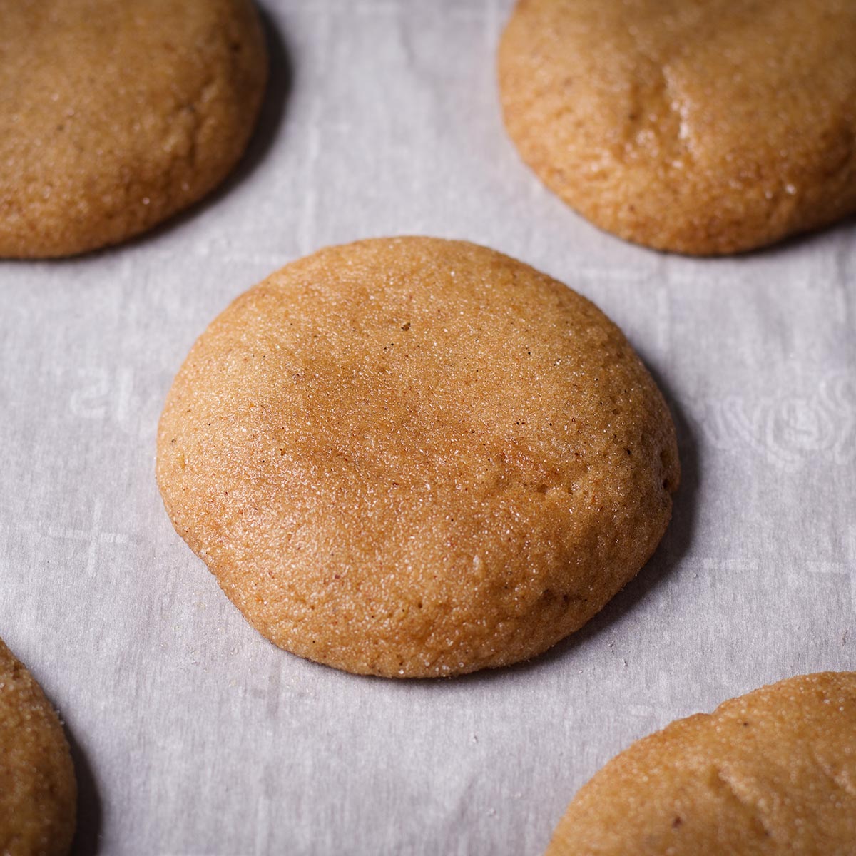 A baking sheet filled with fresh baked brown sugar cookies.
