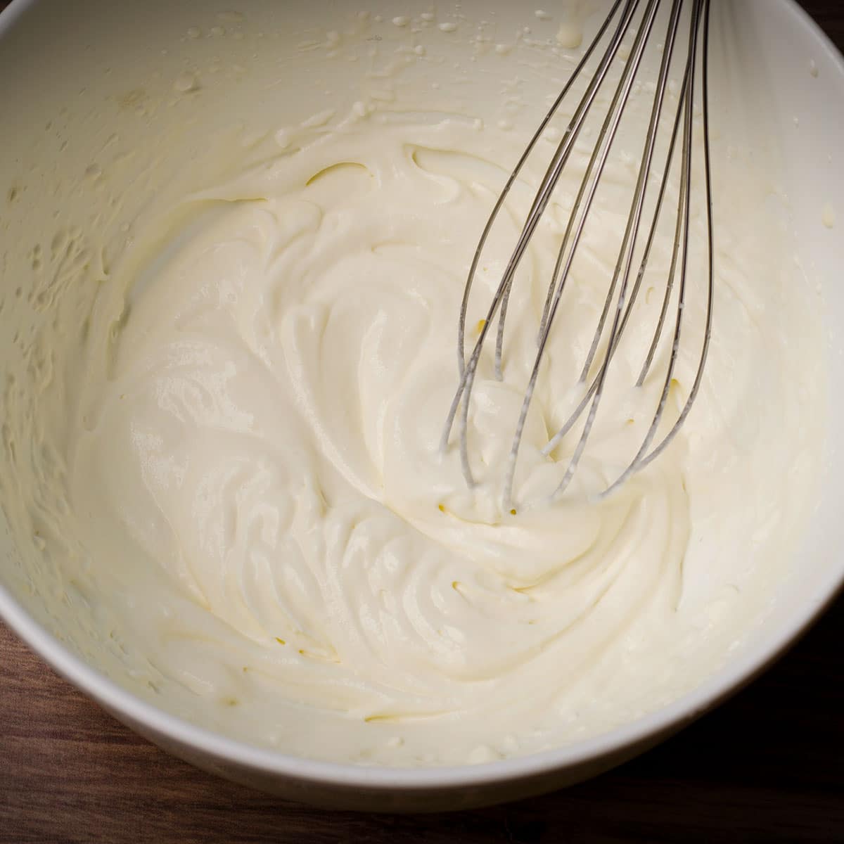 Use an electric mixer to beat heavy cream until thick enough to hold its shape.