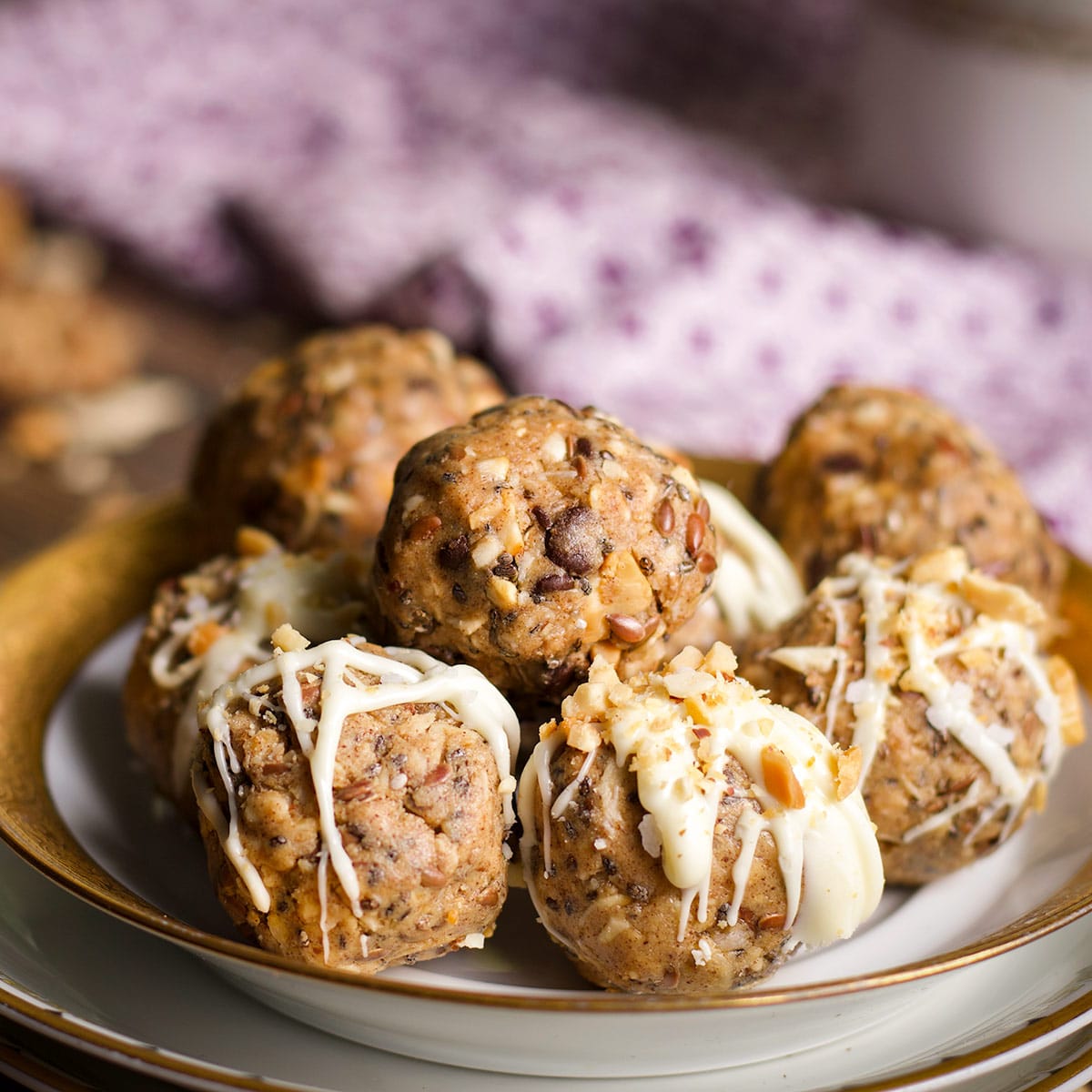 A plate of chocolate chip protein balls and white chocolate vanilla protein balls.